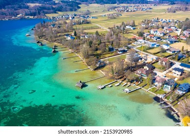 Aerial view of the lake shore at Lake Attersee with a beach and wooden piers. In the municipality of Seewalchen. Salzkammergut, Upper Austria