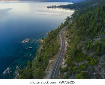 Aerial View Of Lake Tahoe And The Road Around It. 