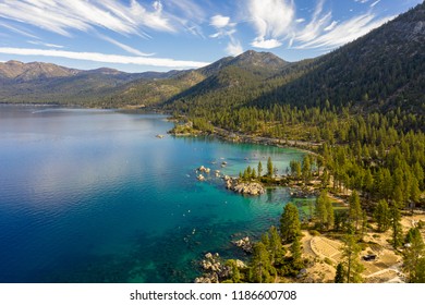 Aerial View Of Lake Tahoe Shoreline With Mountains And Turquoise Blue Waters