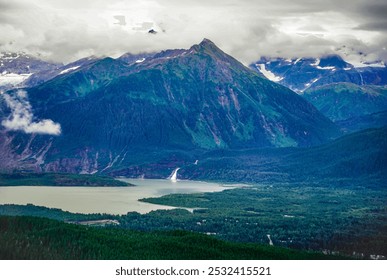 Aerial view of Lakes, waterfalls, misty green mountains, glaciers, spruce conifer forests and snow at Juneau Alaska - Powered by Shutterstock