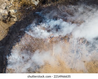 Aerial View Of Landfill With Burning Trash Piles