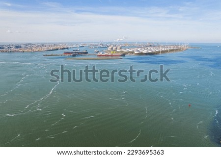 Aerial view of the landscape around the Maasvlakte a massive man-made extension of Europoort port and industrial facility within Port of Rotterdam in Netherlands. High quality photo