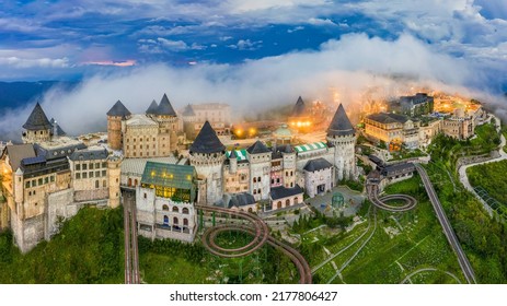 Aerial view of landscape is castles covered with fog at the top of Bana Hills, the famous tourist destination of Da Nang, Vietnam. Near Golden bridge. Panorama French village - Shutterstock ID 2177806427