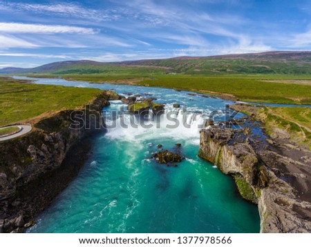 Aerial view landscape of the Godafoss famous waterfall in Iceland. The breathtaking landscape of Godafoss waterfall attracts tourist to visit the Northeastern Region of Iceland.