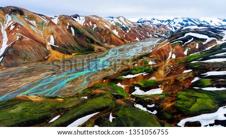 Aerial view landscape of Landmannalaugar surreal nature scenery in highland of Iceland, Europe. Beautiful colorful snow mountain terrain famous for summer trekking adventure and outdoor walking.