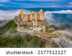 Aerial view of landscape is lunar castles covered with fog at the top of Bana Hills, the famous tourist destination of Da Nang, Vietnam. Near Golden bridge. Panorama