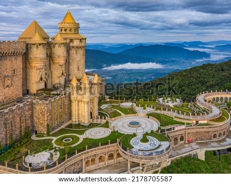 Aerial view of landscape is lunar castles covered with fog at the top of Bana Hills, the famous tourist destination of Da Nang, Vietnam. Near Golden bridge. Panorama