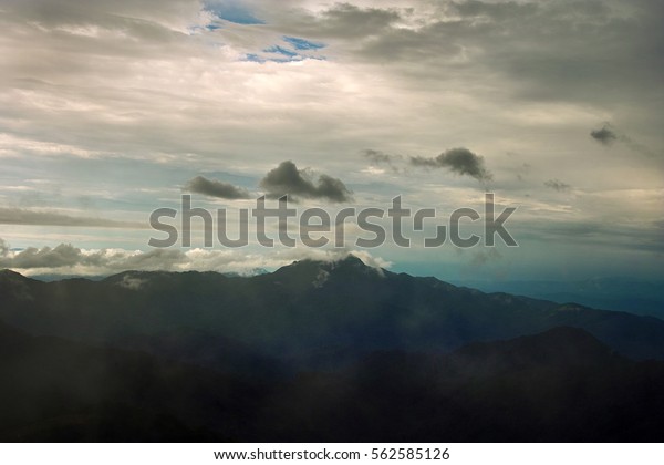 Aerial view landscape from sky\
birds eye natural landscape rocky mountains lake streams rivers\
water fall above beautiful cloud formation atmosphere\
stratosphere