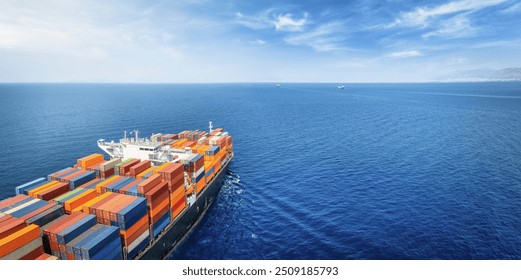 Aerial view of a large, industrial container cargo ship sailing over the ocean with copy space - Powered by Shutterstock