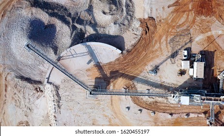 Aerial view of a large Quarry during work hours with Stone sorting conveyor belts.