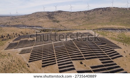 Aerial view of a large solar array in Plasencia, CÃ¡ceres, Spain, generating electricity for the grid amid the western Spanish countryside.