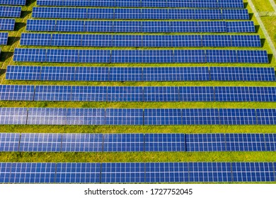 Aerial View Of Large Solar Farm With Hundreds Of Rows Of Energy Efficient Panels Producing Sustainable Renewable Energy In Maryland United States