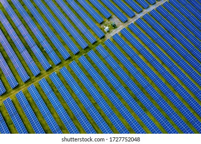 Aerial View Of Large Solar Farm With Hundreds Of Rows Of Energy Efficient Panels Producing Sustainable Renewable Energy In Maryland United States