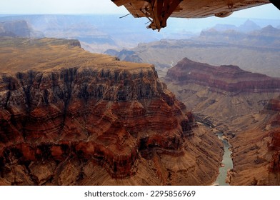 Aerial view Late afternoon in the Grand Canyon Arizona with airplane wing in frame - Powered by Shutterstock