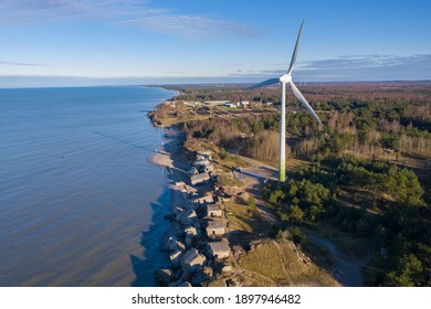 Aerial View Of Liepaja Northern Forts, Old Abandoned Fortifications At Baltic Sea Coast In Latvia. Large Wind Turbine