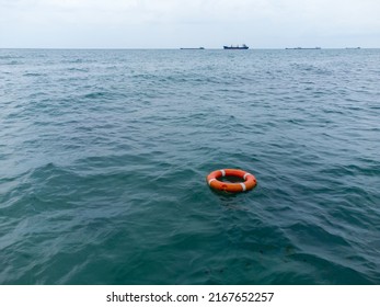 Aerial view of lifebuoy in the sea. Life ring floating in a sea. - Powered by Shutterstock