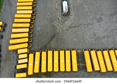 An Aerial View Of A Line Of Parked School Buses