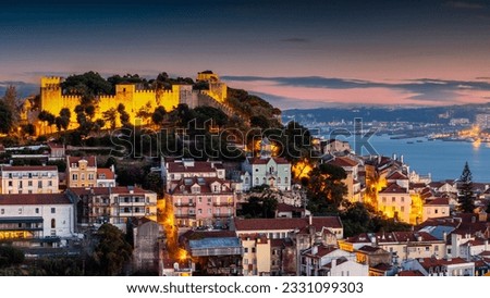 Aerial view of Lisbon cityscape during dusk time with beautiful sky , Portugal