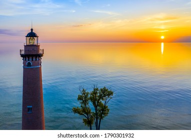 Aerial view of Little Sable Point Lighthouse at sunset over Lake Michigan; Mears, Michigan; Silver Lake State Park