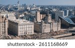 Aerial view of Liverpool showcasing the Three Graces, Radio City Tower, and Museum of Liverpool along the waterfront under clear weather.
