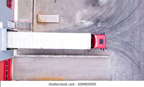 Aerial View Of Loading Warehouse With Semi Truck. Aerial