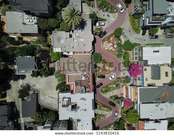 Aerial view Lombard Street, an east–west street in\
San Francisco, California that is famous for a steep, one-block\
section with eight hairpin turns. Crookedest, steep hills, sharp\
curves, one-way road