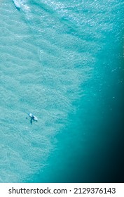 Aerial View Of Lone Surfer