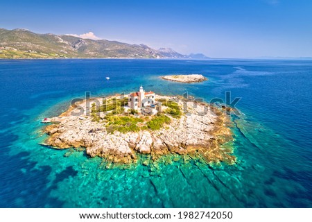Aerial view of lonely island with lighthouse, Korcula riviera of Croatia, island Vela Sestrica
