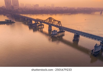 Aerial view of Long Bien bridge over Hong river (or Red river) that connects two districts, Hoan Kiem and Long Bien in Hanoi city, Vietnam. Travel and landscape concept - Powered by Shutterstock