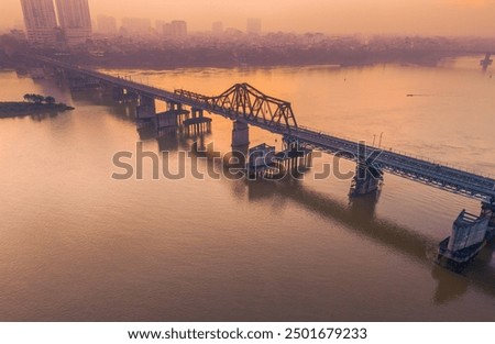 Aerial view of Long Bien bridge over Hong river (or Red river) that connects two districts, Hoan Kiem and Long Bien in Hanoi city, Vietnam. Travel and landscape concept
