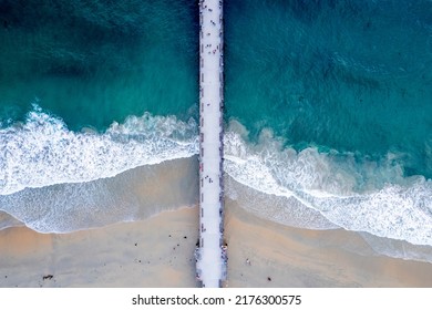 An aerial view of a long bridge in Newport Beach, California