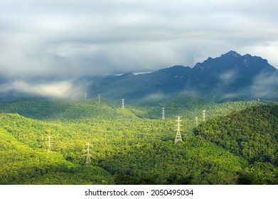 Aerial view long exposure Transmission tower in green forest and beautiful morning smooth fog. Energy and environment concept. High voltage power poles. Pang Puay, Mae Moh, Lampang, Thailand. - Powered by Shutterstock