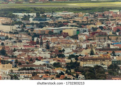 Aerial View, Long Focus Lens Shot Of The Historic Town Of San Cristobal De La Laguna In Tenerife. Mirador De Jardina. Streets And Tiled Roofs Of Historic Buildings And Towers Of Cathedral.