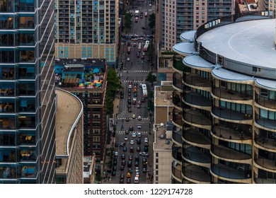 Aerial view looking down through the buildings on the crowded city streets of Chicago Illinois from above