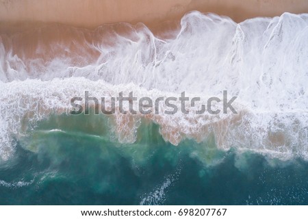 Similar – Aerial Panoramic Drone View Of Blue Ocean Waves Crushing On Sandy Beach in Portugal