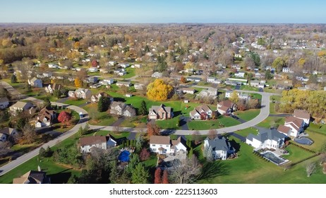 Aerial view low-density two story residential house in sprawl development outward expansion suburbs of Rochester, New York. Upscale suburban home with large lot size, green grassy lawn, fall season - Shutterstock ID 2225113603