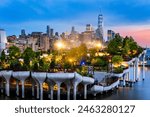 Aerial view of Lower Manhattan skyline at at dusk, behind the Little Island public park.