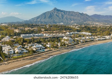 Aerial view of the luxurious Marbella resort town, Costa del Sol, Andalusia, Spain. Popular luxury and exclusive area of Marbella, Golden Mile beach. Top view of the expensive villas and hotels - Powered by Shutterstock