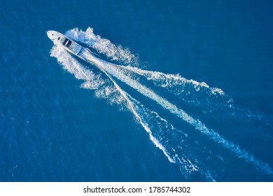 Aerial View Luxury Motor Boat. Drone View Of A Boat Sailing. Top View Of A White Boat Sailing To The Blue Sea. Motor Boat In The Sea. Travel - Image.