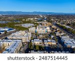 Aerial view of Main Street Cupertino residential and commercial neighborhood in San Francisco Bay Area, California. Silicon Valley skyline. Looking toward downtown San Jose