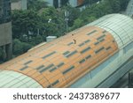 aerial view, maintenance process on the roof of the Kuningan Jakarta LRT station