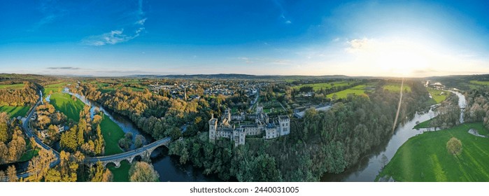 Aerial view of majestic Lismore Castle in County Waterford, Ireland, bathed in the golden glow of the setting sun on the first day of spring, showcasing its timeless beauty and historic charm - Powered by Shutterstock