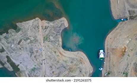 Aerial View Mangla Lake Or River Drone Shot, Boat Or Ship Standing At Riverbank Or Lake Shore With People Swimming, Pakistani Or Indian Or South Asian Drone Shot, Kashmir Valley