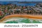 Aerial View of Manly Beach and Sydney harbour with manly houses on a warm summer day blue skies Sydney NSW Australia