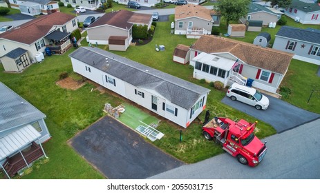 Aerial View of a Manufactured, Mobile, Prefab Home Being Removed from a Lot in a Park