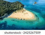 Aerial view of Marathonisi Island near Zakynthos island in Greece. Marathon island at sunrise in Zante, Ionian sea. Idyllic beach with turquoise sea water