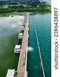 Aerial view of the Marina Barrage separating the freshwater reservoir from the outside ocean in the city of Singapore