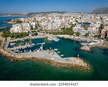 Aerial view of the marina at the bustling tourist resort of Nea Chora in Chania, Crete, Greece - Shutterstock ID 2294014427