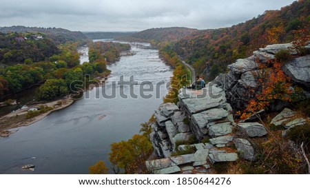Aerial view of Maryland Heights Cliff on a foggy day with fall tree foliage 