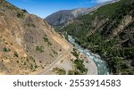 Aerial view of the Maule River, between mountains of the Andes mountain range.